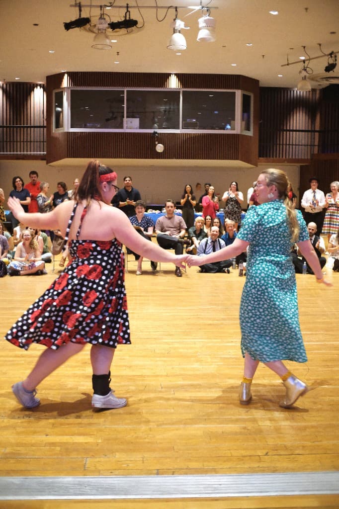 People dancing together at a local event
